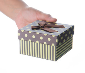 Hand holding small box for a gift isolated on white