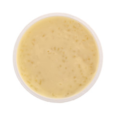Top view of tapioca pudding in an opened container isolated on a white background.