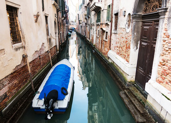  boat on a canal of Venice, Italy