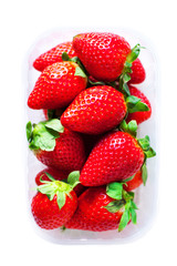 Fresh Strawberries in a box isolated on white  background close up.
