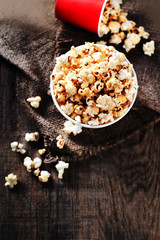 Homemade Kettle Corn Popcorn on wooden rustic table with copy space .