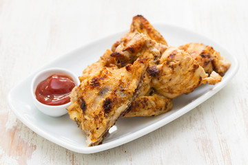 grilled chicken with sauce on dish