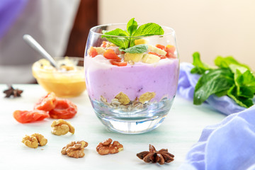 yogurt with muesli and pieces of fruit