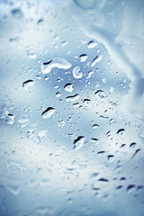 Rain water drops on glass background