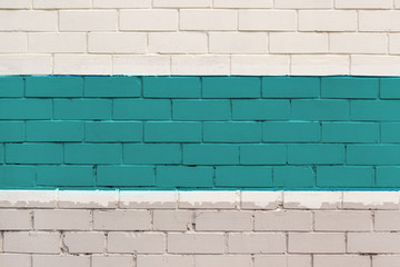 Brick wall painted in cyan and gray color