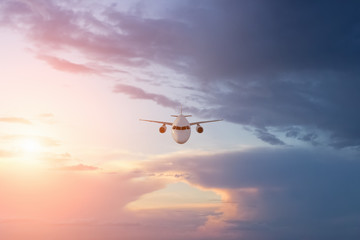 Airplane  plane  in beautiful  sky at sunset