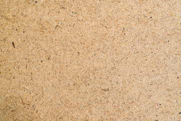 The texture of the beige cardboard