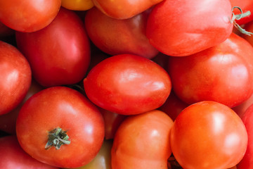 Fresh red tomatoes background. Group of tomato