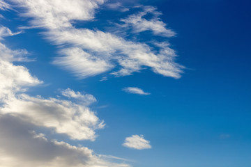 Epic blue sky with white fluffy clouds. Sunny day