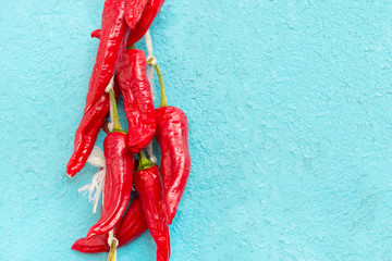 red hot Chili peppers on blue painted table