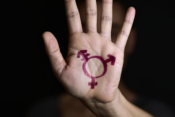 transgender symbol in the palm of the hand