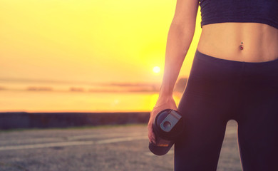 Close up portrait of a sports girl  holding a shaker with protein