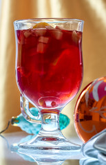 Hot mulled wine in a glass cup