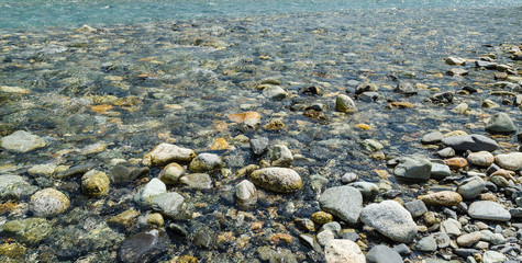 Stone under transparent water for use as background