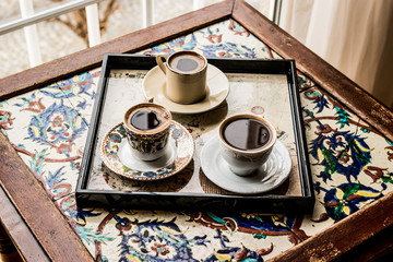 Turkish Coffee on ottoman surface.