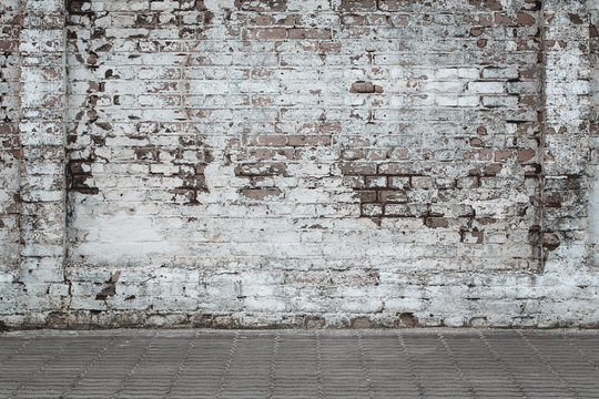 Urban background, white ruined industrial brick wall whith copy space
