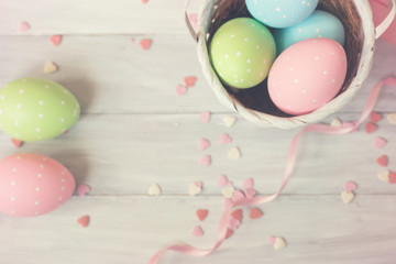 Fototapeta na wymiar Easter eggs decoration - painted eggs on wooden background