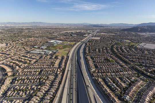 Aerial view of desert suburban sprawl along the 215 freeway in the Summerlin area of Las Vegas, Nevada.