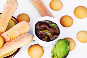 Long and rounded ladyfinger cookie,mousse chocolate and pistachio.