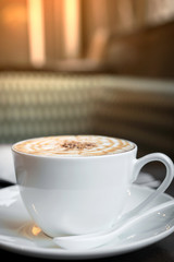 Cup of cappuccino in coffee shop  