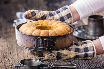 Marble cake.Easter Cake. Marble cake cup of coffee powder sugar and kitchen vintage utensil.