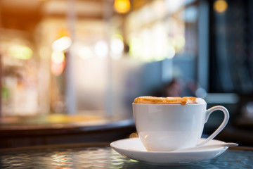 Cup of cappuccino in coffee shop  