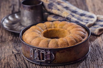 Marble cake.Easter Cake. Marble cake cup of coffee powder sugar and kitchen vintage utensil.