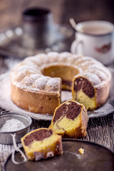 Marble cake.Easter Cake. Marble cake cup of coffee powder sugar and kitchen vintage utensil.