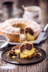 Marble cake.Easter Cake. Marble cake cup of coffee powder sugar and kitchen vintage utensil.