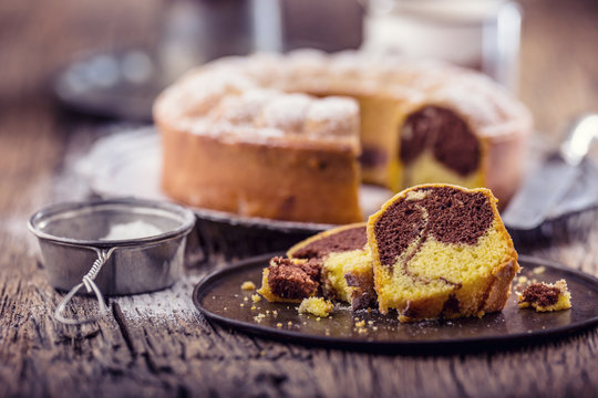 Marble cake.Easter Cake. Marble cake cup of coffee powder sugar and kitchen vintage utensil.