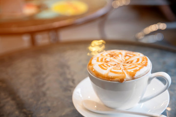 Cup of cappuccino in coffee shop  