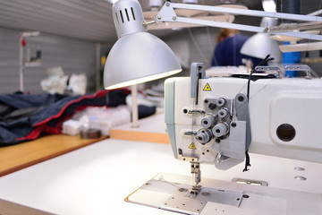 sewing machine. Equipment garment factory. The concept of the textile industry.