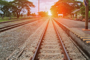 railway track on gravel  for train transportation with sunset light tone