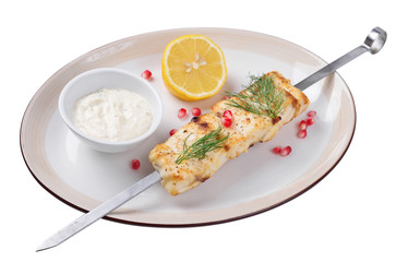 sturgeon with lemon sauce and grilled. Isolated.