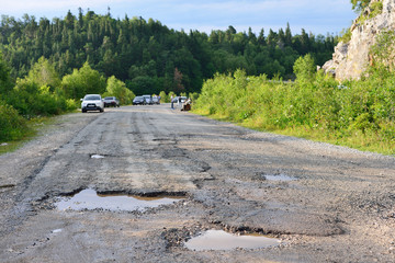 hole in the asphalt, bad road, the risk of movement by car