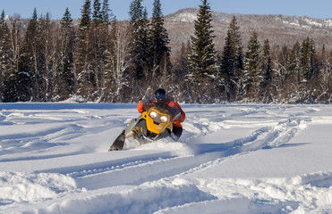 Athlete on a snowmobile