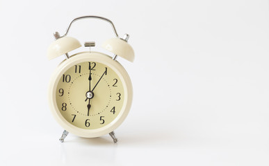 Retro color alarm clock on white background
