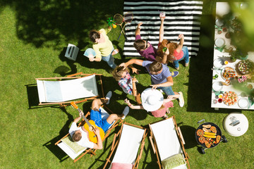 Friends dancing in garden