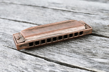 Harmonica on a wooden table