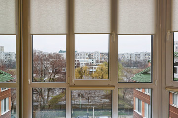 Window view on school stadium and buildings in center of chisinau, moldova