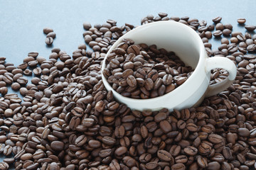 scattering of coffee beans with cup