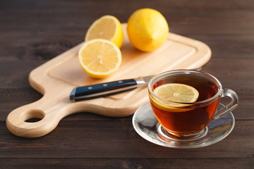 slice lemon on wood chopping board with background, close up