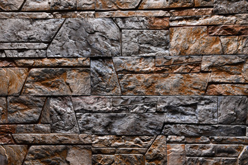 Grey Orange Stone wall texture background natural color