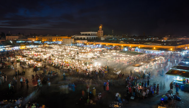 Famous square Jemaa El Fna busy with many people and lights during the night, medina of Marrakesh, Morocco