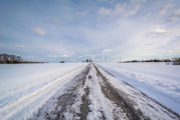 Fototapeta na wymiar Snow covered road in a rural area of York County, Pennsylvania.