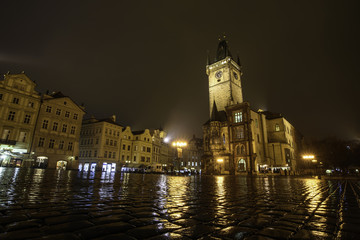 Fototapeta na wymiar Tower at the Town Hall Square in Prague. At night after the rain.