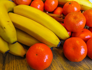 Fresh bananas and tangerines