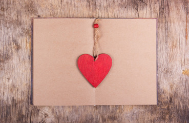 Red heart and open blank book