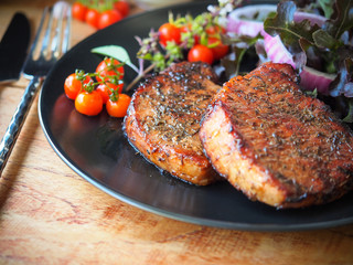 Grilled pork chop steak.