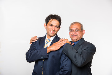 Family business,team work, success. Portrait of Indian Young and senior businessman, lawyer,...